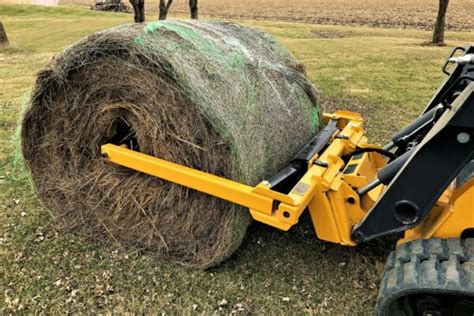 round bale unroller for skid steer|round bale unroller manual.